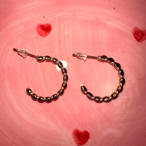 small golden metal hoop earrings.